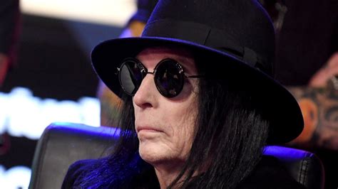 Battling Through Personal Challenges: Mick Mars' Health Struggles