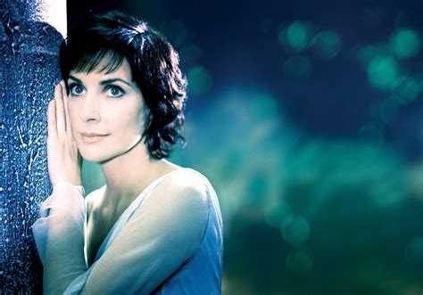 Unraveling Enya's Financial Success: Examining the Monetary Triumphs of the Mysterious Songstress